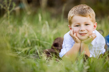 Portrait of happy little boy smiling on farm