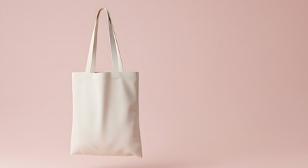 Blank white tote bag, floating against a soft pink background. totebag, tote bag, tote-bag mockup for design and fashion
