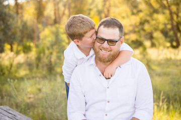 Father and son portrait in rural Australian bush setting