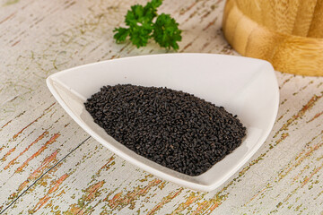 Black dry Nigella seeds in the bowl