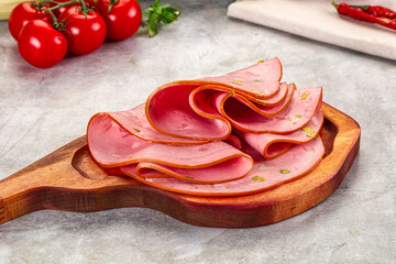 Mortadella pork sausages slices heap