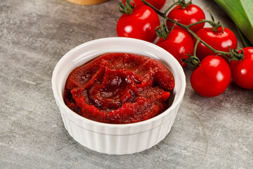 Red tomato paste in the bowl