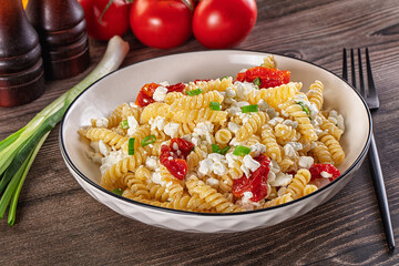 Italian pasta fusili with curd