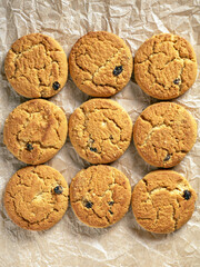Flat lay of round crackers arranged on a white paper background