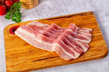 Raw bacon pork meat slices