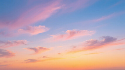 Fototapeta premium A serene view of a pastel colored sky with soft clouds during sunset or sunrise time of the day