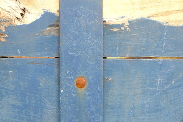 weathered blue and white wooden board