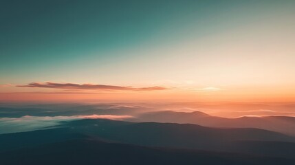 Fototapeta premium Panoramic sunrise over misty mountain range