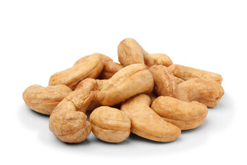 Roasted cashew nuts piled up on the floor. isolated on white background.