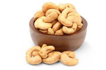 Roasted cashew nuts in a wooden cup. isolated on white background.