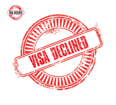 A red rubber stamp with the words 'VISA DECLINED' stamped on it, indicating a rejection of a visa application. This symbolizes travel restrictions and denial of entry.