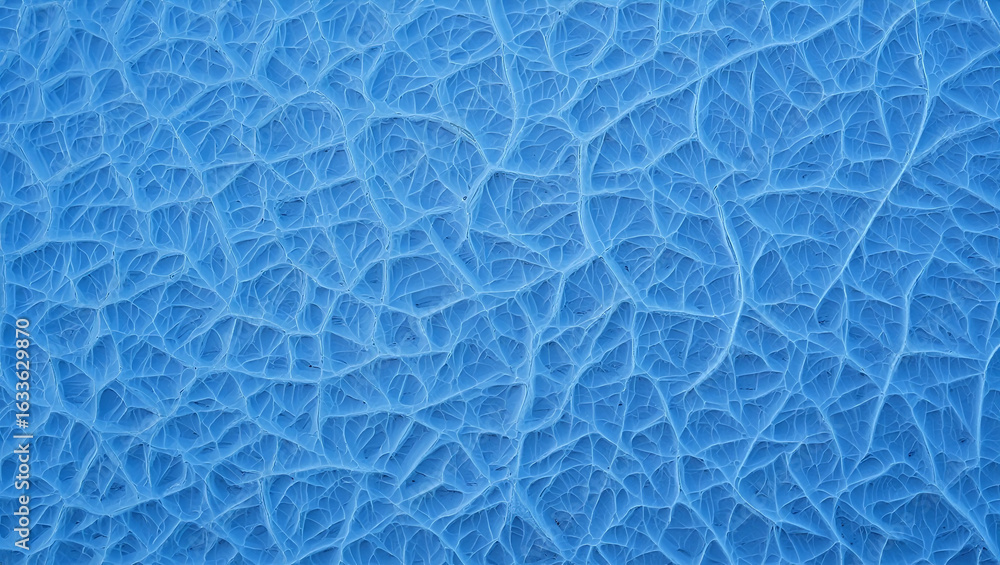Poster intricate patterns form within the blue ice, showcasing a beautiful network of cracks and lines acro