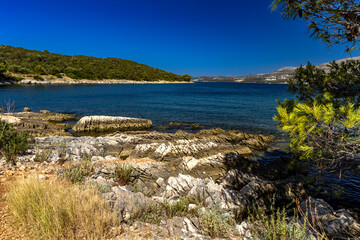 Empty pebble beaches, walking path along the island of Ciovo to Pendi Lagoon, panorama overlooking...