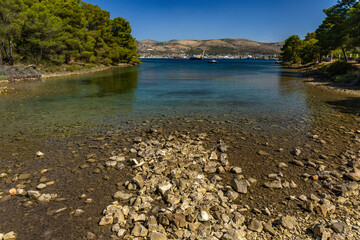 Empty pebble beaches, walking path along the island of Ciovo to Pendi Lagoon, panorama overlooking...