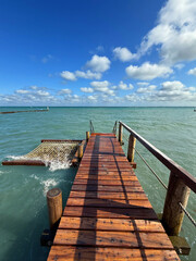 Staircase Leading from Pier to the Sea Under a Bright Summer Sky
