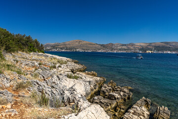 Empty pebble beaches, walking path along the island of Ciovo to Pendi Lagoon, panorama overlooking...
