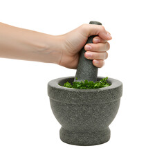 Hand holding a mortar while using the pestle to crush herbs, isolated background with mockup space