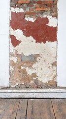 Naklejka premium Aged brick wall with peeling paint and rustic wooden floor, a captivating distressed background texture for vintage architectural designs and urban decay aesthetics.
