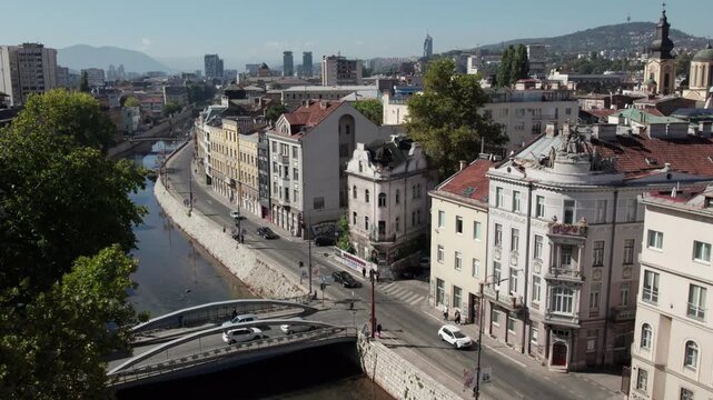 Aerial view of Sarajevo the capital of Bosnia and Herzegovina with the river Miljacka and cars on the road