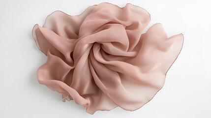 A delicate swirl of lightweight, translucent dusty rose fabric arranged in soft, elegant folds on a plain white background.