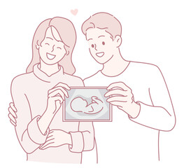 Happy couple cherishing their baby's ultrasound photo, celebrating their upcoming journey into parenthood.
