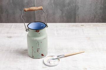 Woman is renovating an old steel bucket. Step by step, tutorial.