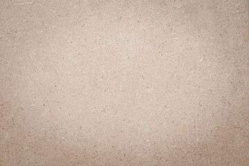 White particleboard, chipboard background with grainy texture of Medium Density Fiberboard (MDF), particle presses wooden panel, OSB Oriented strand board in light beige brown cream sepia color