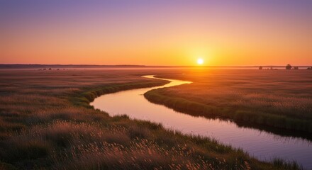 A gentle, meandering river flowing through a golden meadow during a soft, hazy sunset.