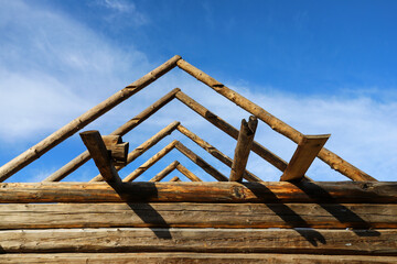Roof installation in a traditional rural wooden house.