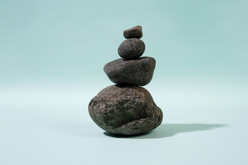 Balanced Stone Tower on a Light Blue Background