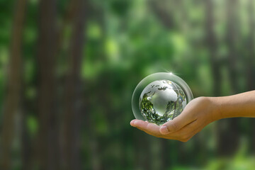 World Ozone Day. A human hand holding a glass globe with a protective layer. environmental and ecological saving. environmental protection, Save the world and the environment, Earth Day .ESG.CSR