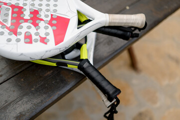 Paddle tennis rackets left on table, close up