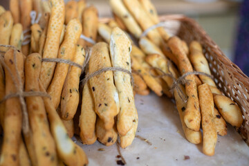 Breadsticks, grissini, grissino, sold in the form of bars. French sticks, salted with caraway,...