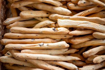 Breadsticks, grissini, grissino, sold in the form of bars. French sticks, salted with caraway,...