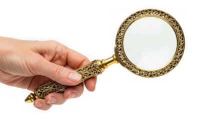 A hand holds an ornate gold magnifying glass against a transparent background for inspection and examination