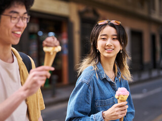Portrait of a smiling couple in the city, tourists visiting destination, summer trip exploring and...
