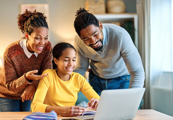 Mother, father and daughter doing homework with laptop at home. Mom, dad and teenage black girl happy using laptop. Teen girl and parents sitting at home working with notebook