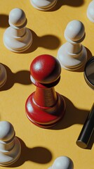 Red Chess Pawn Standing Out Among White Pieces on Yellow Background chess pawn red pawn white pawns