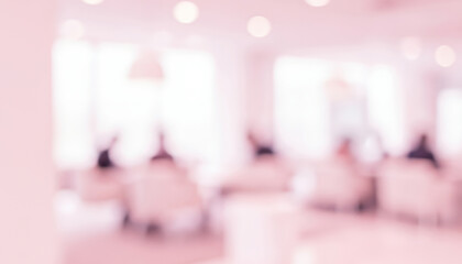 Blurred interior view showing people seated in a bright light space, with soft tones and glowing ambiance suggesting a communal area designed for openness and calm interaction.