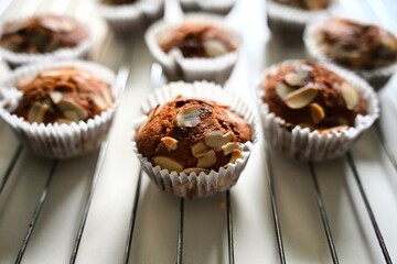 Gluten-free almond muffins cooling after baking. Homemade gluten-free treats support healthy eating...
