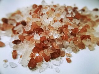 Close-Up of Colorful Himalayan Salt Crystals in Pile on White Background
