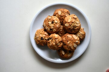 Gluten-free almond muffins on a white plate. Healthy homemade baked goods, perfect for clean eating, wellness lifestyle, and nutritious snack or breakfast ideas.