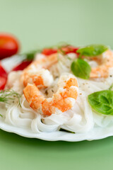 Protein dish rice noodles with shrimp and tomato slices