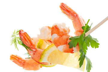 Still life of shrimps with lemon on white background