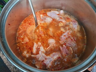 Cook meat stew in a pot