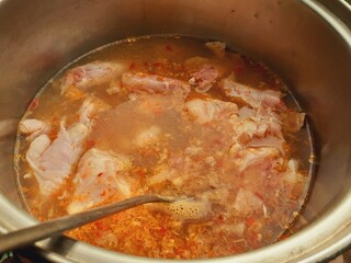 Cook meat stew in a pot