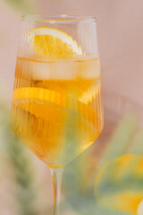 Orange lemonade in a glass. Summer cocktail. Aperol spritz.