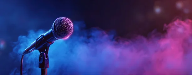 Close-up of a microphone on stage with a blue and purple neon light background. © Supernova