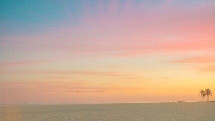 Fototapeta premium Couple walking on a beach at sunset with colorful sky