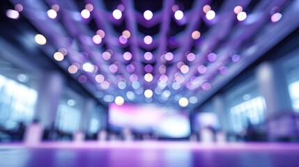 Blurry view of a conference space with decorative purple lights creating an ambient atmosphere for events.